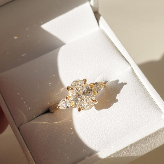 4.5ct Oval Center Stone with Two Side Pear Cut Lab Grown Diamond Ring Stunning diamond ring, classic gold band, engagement proposals, high-end jewelry, wedding occasions. YouTube Amazon Facebook Weather Google Gmail Wordless WhatsApp Web Translate News blog post ring ceremony Article Life Money 2025 design Ring Ceremony Diamond Shape Diamond Ring Surat Diamond India Market Diamond Ring for Her Diamond Ring for Men Diamond Ring Women Engagement Ring Finger For Her Finger Ring Gold Ring Bluestone Ring Diamond