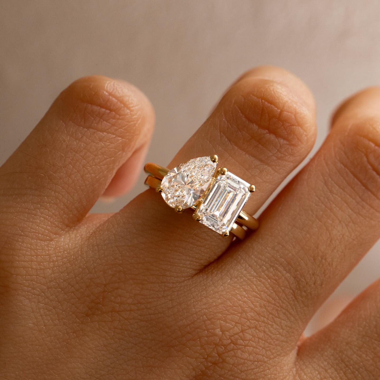 3ct Pear & Emerald Toi Et Moi Lab Grown Diamond Modern  diamond solitaire ring on a gold band, styled with a natural manicure. A perfect symbol of love for engagements, proposals, weddings, or premium jewelry collections. Ring Ceremony Diamond Shape Diamond Ring Surat Diamond India Market Diamond Ring for Her Diamond Ring 