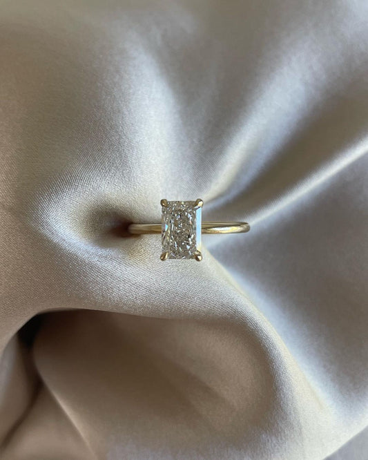 7ct Radiant Cut Four Claw Lab Grown Diamond Solitaire Ring Minimalist  diamond ring on a gold band, symbolizing timeless elegance, showcased on a naturally manicured hand. diamond ring, gold engagement ring, luxury bridal jewelry  and anniversary diamond ring YouTube Amazon Facebook Weather Google Gmail Wordless WhatsApp Web Translate News blog post ring ceremony Article Life Money 2025 design Ring Ceremony Diamond Shape Diamond Ring Surat Diamond India Market Diamond Ring for Her Diamond Ring for Men 