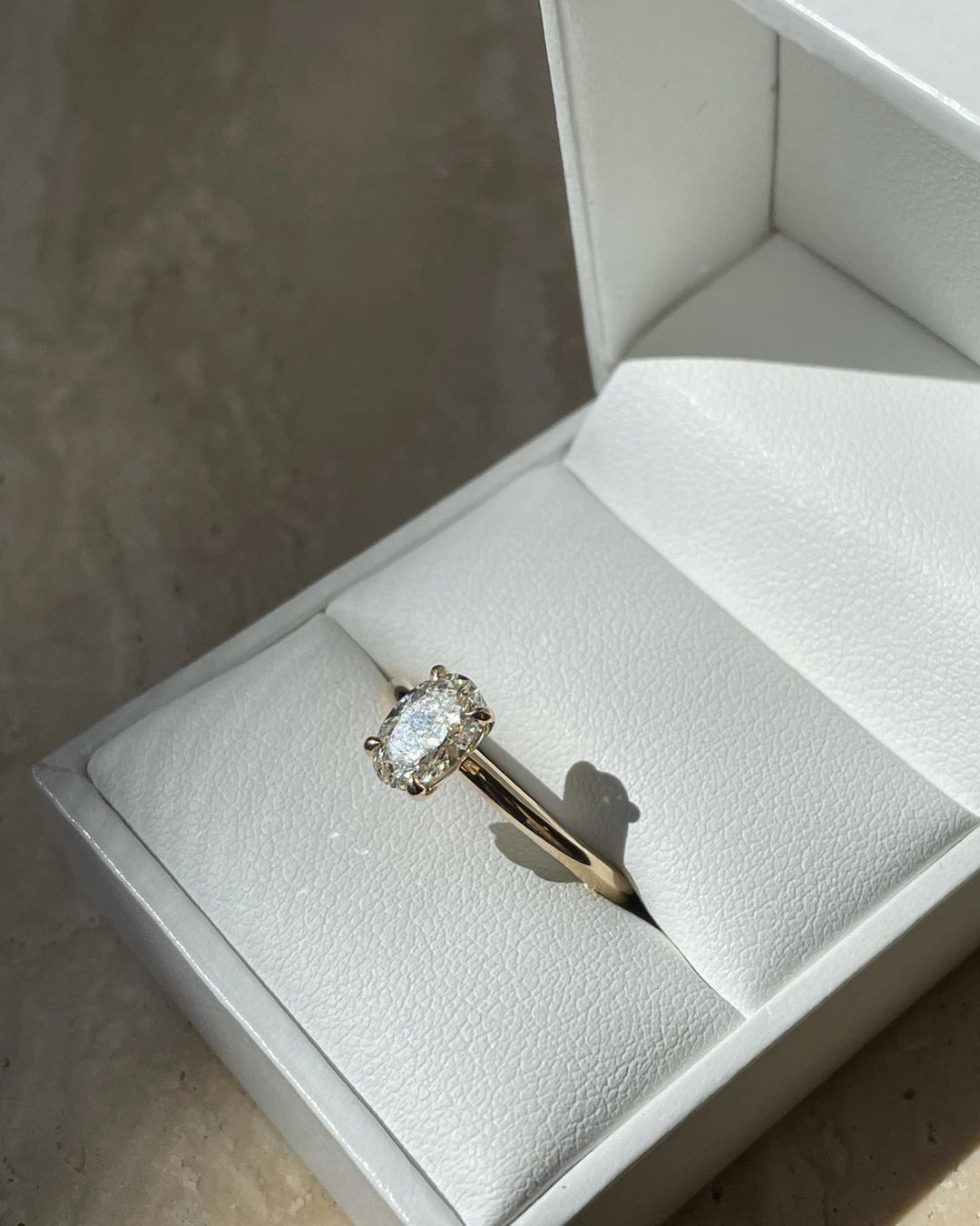 3ct Oval Solitaire Round Gold Band Lab Grown Diamond Ring   The hand displays a soft, natural manicure, highlighting the diamond's brilliance and the ring's refined craftsmanship. Ideal for those seeking timeless, high-end accessories for special occasions. YouTube Amazon Facebook Weather Google Gmail Wordless WhatsApp Web Translate News blog post ring ceremony Article Life Money 2025 design Ring Ceremony Diamond Shape Diamond Ring Surat Diamond India Market Diamond Ring for Her Diamond Ring for Men Diamond