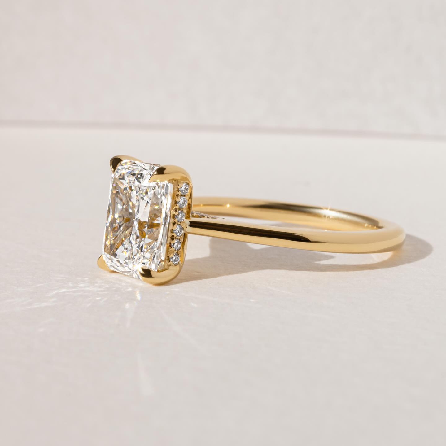 7ct Radiant Cut Juliette Setting with Hidden Halo Lab grown Diamond Ring  The hand displays a soft, natural manicure, highlighting the diamond's brilliance and the ring's refined craftsmanship. Ideal for those seeking timeless, high-end accessories for special occasions. YouTube Amazon Facebook Weather Google Gmail Wordless WhatsApp Web Translate News blog post ring ceremony Article Life Money 2025 design Ring Ceremony Diamond Shape Diamond Ring Surat Diamond India Market Diamond Ring for Her Diamond Ring 