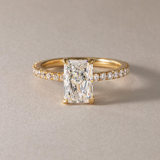 7ct Radiant Cut Juliette Setting with Hidden Halo Lab grown Diamond Ring Close-up of a hand adorned with a sparkling  diamond ring on a sleek gold band, featuring a modern and elegant design. The ring is perfect for engagement, wedding, or luxury jewelry collections. YouTube Amazon Facebook Weather Google Gmail Wordless WhatsApp Web Translate News blog post ring ceremony Article Life Money 2025 design Ring Ceremony Diamond Shape Diamond Ring Surat Diamond India Market Diamond Ring for Her Diamond Ring for 