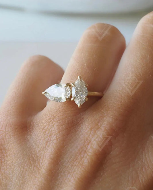 2.10tcw marquise and pear-shaped lab-grown diamond ring with a unique Toi et Moi setting, ideal for a meaningful and sustainable wedding or promise ring.