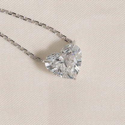 pendant set with a 3 carat Heart cut diamond in white gold 