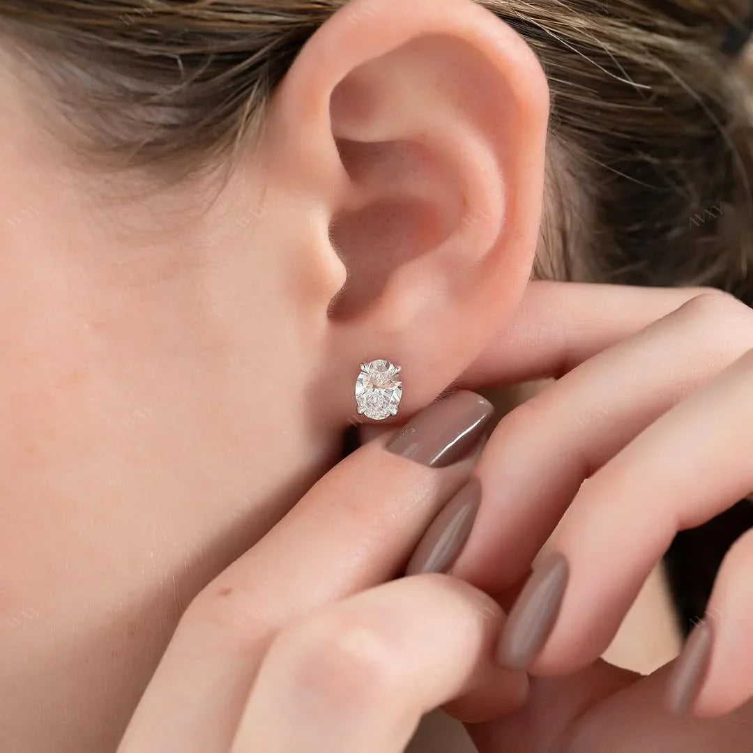 Stud Earrings set with 2 carat Oval cut diamonds in white gold 