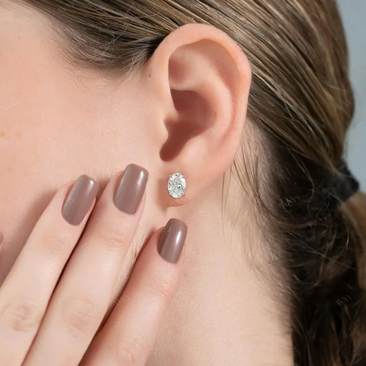 Stud Earrings set with 2 carat Oval cut diamonds in white gold 