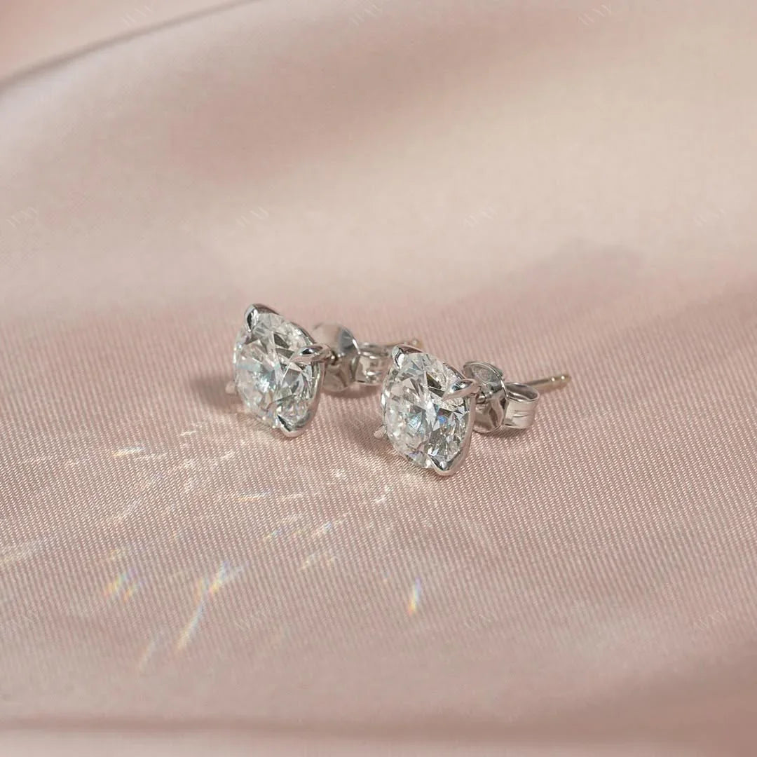The 4 CTW Stud Earrings set with Round cut diamonds in white gold 