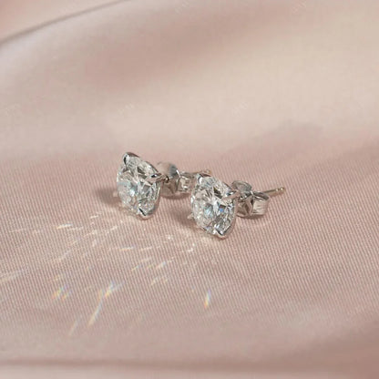 The 4 CTW Stud Earrings set with Round cut diamonds in white gold 