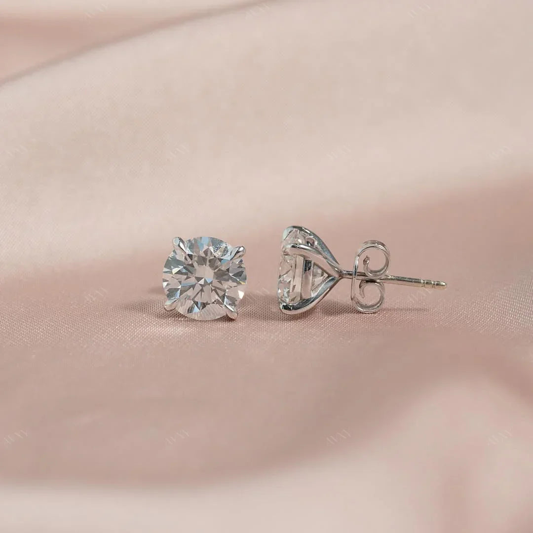 The 4 CTW Stud Earrings set with Round cut diamonds in white gold 