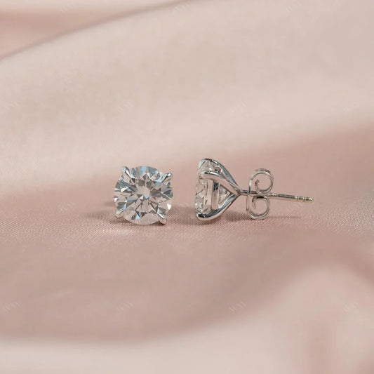 The 4 CTW Stud Earrings set with Round cut diamonds in white gold 